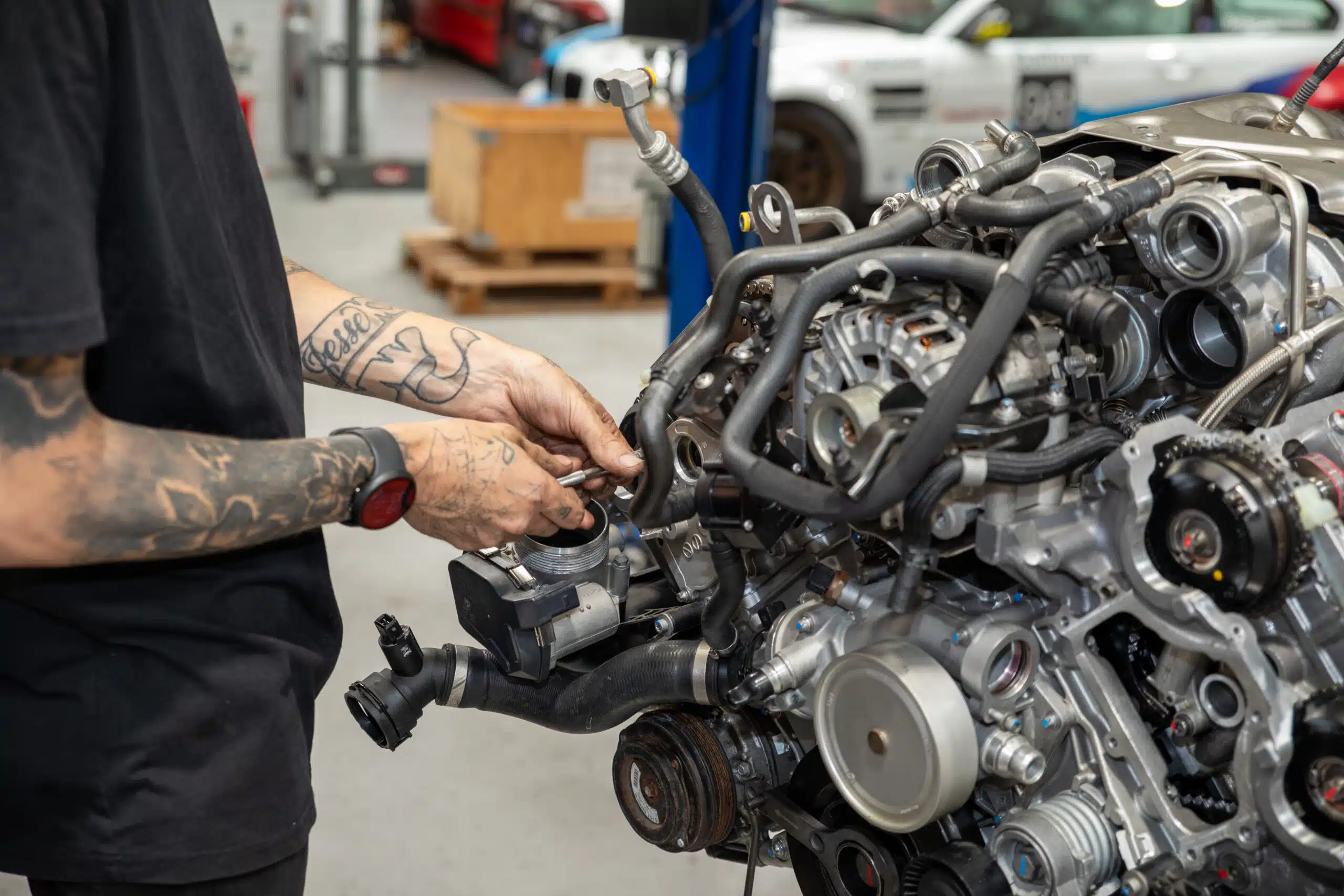 GMW technician is doing engine diagnostics on a huge part